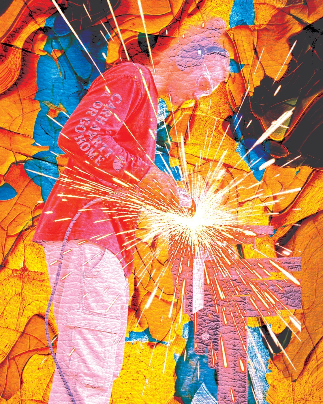 Wojek at work, mid-spark, welding a sculptural piece